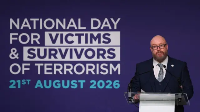 Paul Price speaks during the first National Day for Victims and Survivors of Terrorism memorial event at Lancaster House