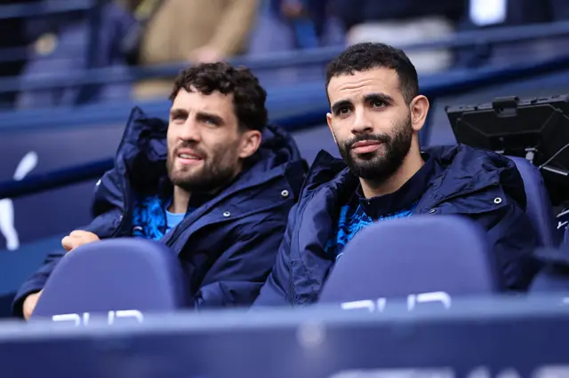 Manchester City players on the bench