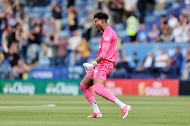 Burton goalkeeper Corey Addai celebrates at Leicester