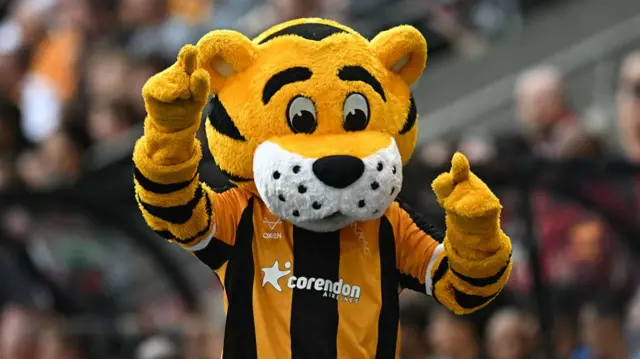 Roary the Tiger enjoying himself during the English Premier League football match between Hull City and Manchester United at the MKM Stadium.