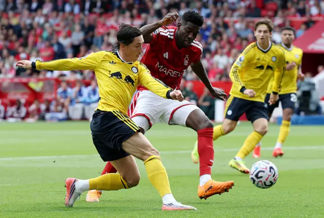 Harry Wilson of Leeds United is challenged by Ibrahim Sangare of Nottingham Forest during the Premier League 2026/27 match between Nottingham Forest FC and Leeds United at City Ground.