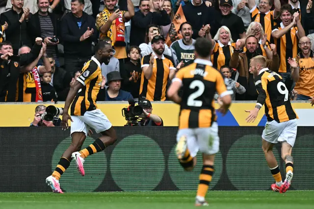 Hull City's Nigerian defender #06 Semi Ajayi (L) celebrates with teammates after scoring the opening goal during the English Premier League football match between Hull City and Manchester United at the MKM Stadium.