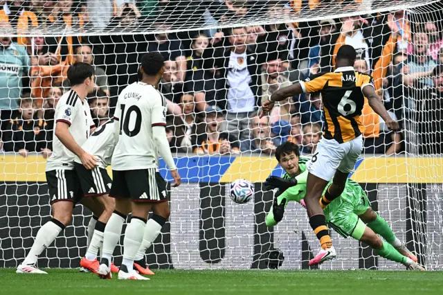 Hull City's Nigerian defender #06 Semi Ajayi (R) scores the opening goal during the English Premier League football match between Hull City and Manchester United at the MKM Stadium.