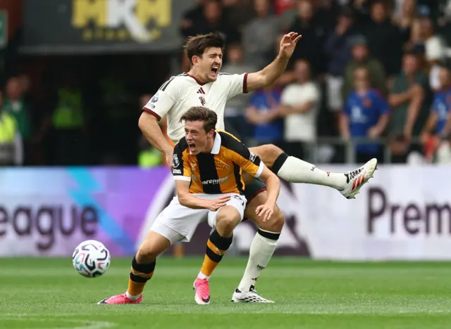 Hull City's Elliot Stroud in action with Manchester United's Harry Maguire