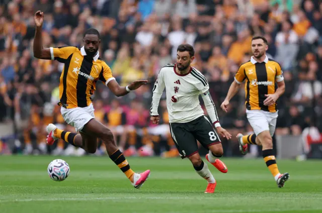 Hull City's Semi Ajayi in action with Manchester United's Bruno Fernandes