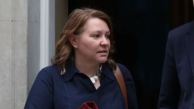 Anna Turley is pictured with a serious look on her face looking off camera, with a dark blue top.