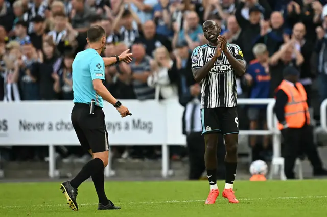 Newcastle United's Congolese striker #09 Yoane Wissa is told to leave the pitch by English referee Stuart Attwell