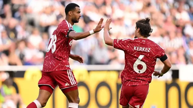 Cody Gakpo of Liverpool celebrates scoring his team’s first goal with Milos Kerkez during the Premier League 2026/27 match between Newcastle United and Liverpool FC at St James' Park