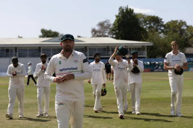 Ian Holland walking off