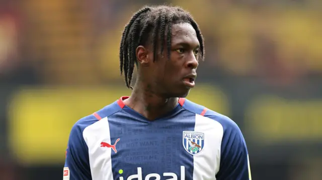 Quevin Castro wearing a West Bromwich Albion navy and white home shirt during a game in 2021