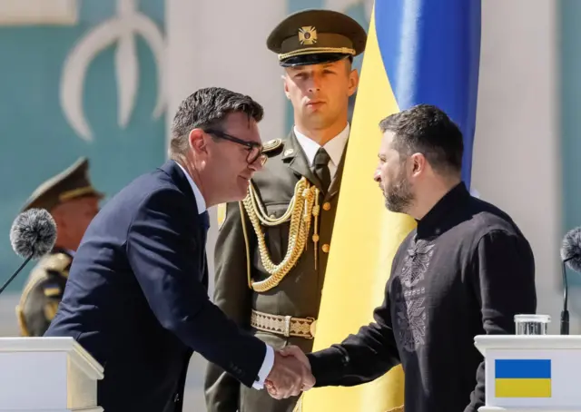 Britain's Prime Minister Andy Burnham greets Ukrainian President Volodymyr Zelenskiy during a celebration ceremony of the Independence Day of Ukraine