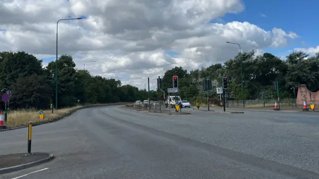 The A66 has two lanes travelling in each direction, with traffic lights in the middle.