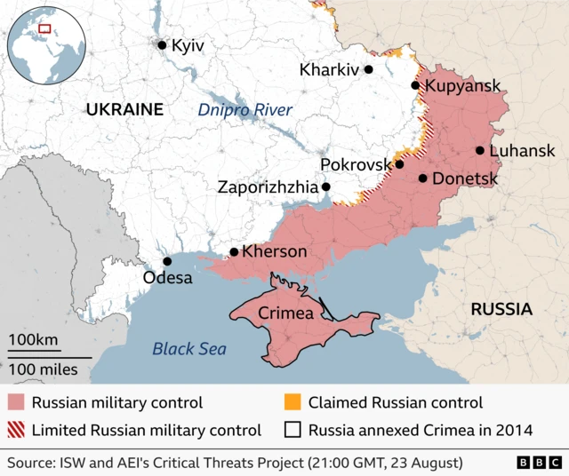 Map of south-eastern Ukraine showing the current front line. Russian-controlled territory is shaded pink, with a concentrated band of red diagonal stripes marking limited or contested control near the line of contact. Orange areas indicate claimed Russian control. Key locations including Donetsk, Luhansk, Kupyansk, Pokrovsk, Kherson and Crimea are labelled, with the Black Sea to the south.
