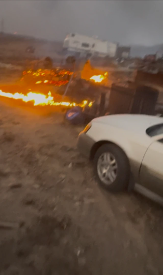 Fire near vehicles at Davis' property