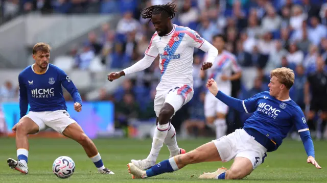 Everton defender Jarrad Branthwaite tackling Crystal Palace's Evann Guessand.