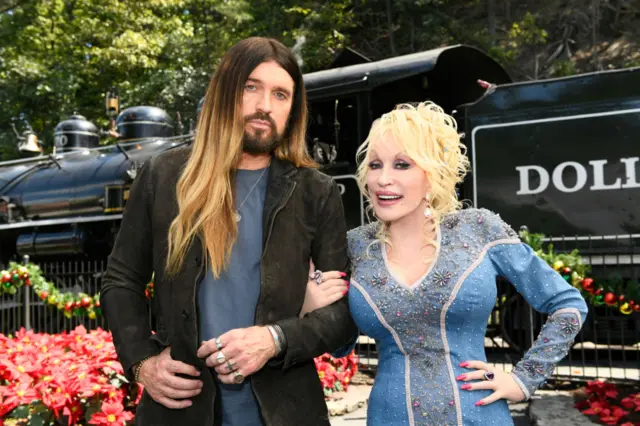 From left ot right: Billy Ray Cyrus and Dolly Parton in 2022