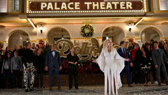 Parton in front of the Palace Theater in Dollywood