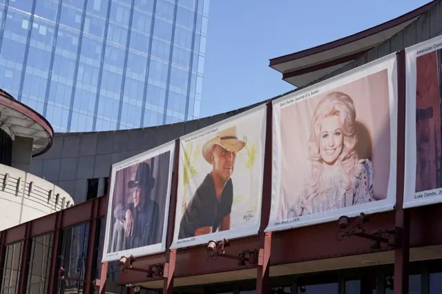 A picture of Dolly Parton and other country musicians on the exterior of the building housing the Country Music Hall of Fame in Nashville.