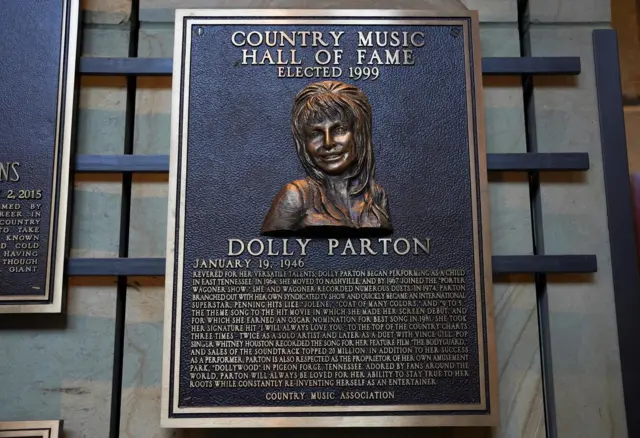 A commemorative plaque of Dolly Parton at the Country Music Hall of Fame.
