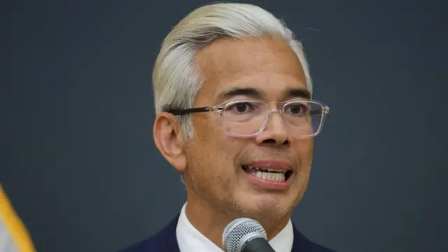 Rob Bonta speaking into a microphone, from the neck up