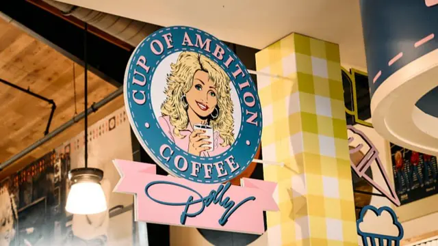 Detail of the signage for Cup of Ambition Coffee inside Dolly's Tennessean Travel Stop in Cornersville, TN on Friday, 17 July, 2026.