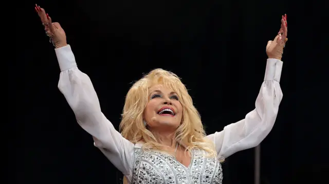 Dolly Parton performs on stage