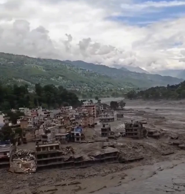 Aftermath of the flood, sediment has covered many collapsed homes