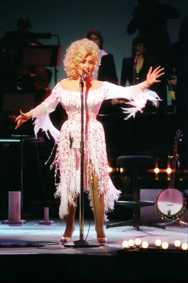 Dolly Parton performs on stage at The Dominion Theatre on March 29th, 1983 in London, United Kingdom