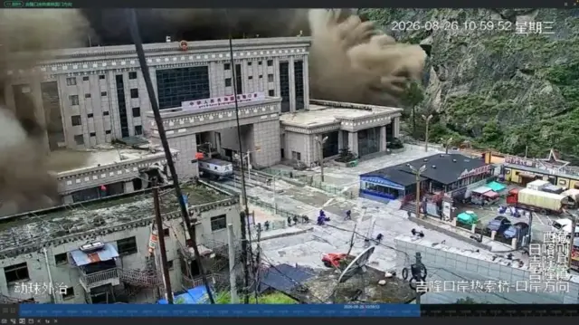 CCTV footage shows people running away as wall of mud and water destroys buildings in a valley in Gyirong, Tibet.