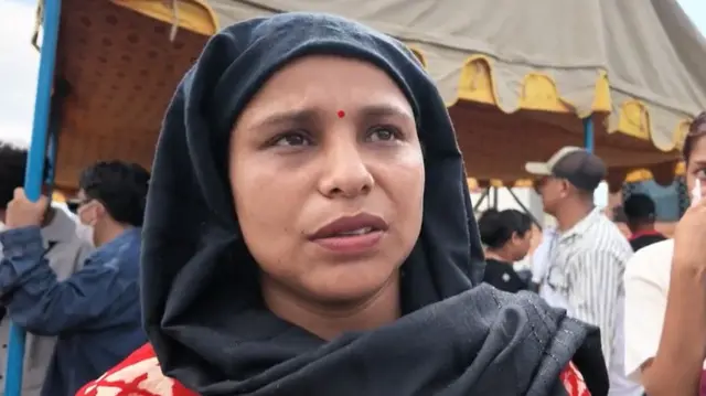 Woman whose husband is missing speaks to BBC at Kathmandu's domestic airport