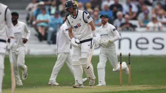 Wil Luxton walks off as the Leicestershire players celebrate