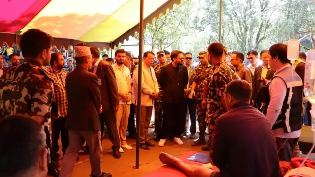 Prime Minister of Nepal, Balendra Shah is surrounded by people after visiting Bidur and surrounding areas of Nuwakot