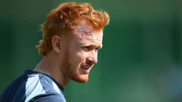 Jordan Cox looks on