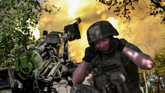 A serviceman of the 148th Separate Artillery Zhytomyr Brigade of the Armed Forces of Ukraine fires a CAESAR self-propelled howitzer towards Russian troops at a position on the front line