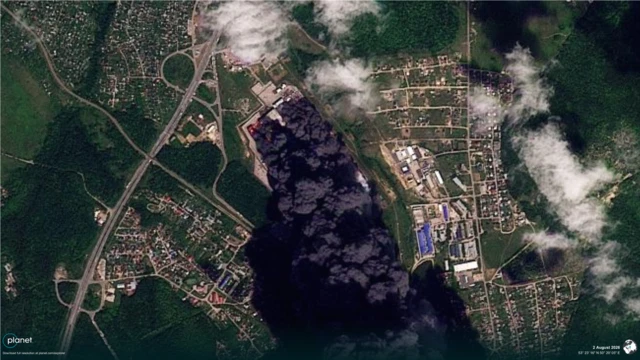 A satellite image showing a thick cloud of black smoke coming from a Wildberries facility in southern Russia