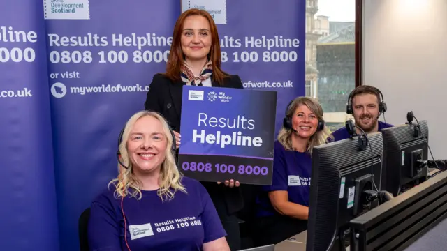 Màiri McAllan with helpline advisors