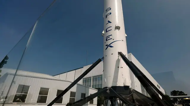 A SpaceX Falcon 9 rocket is displayed at a SpaceX facility on August 04, 2026 in Hawthorne, California.