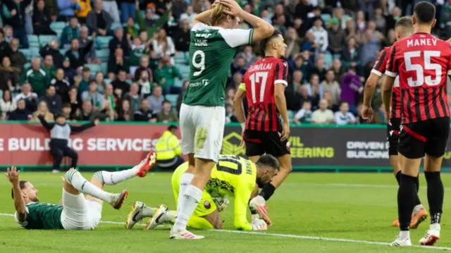 Martin Boyle (left) claimed for a penalty