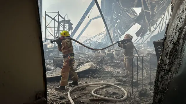 Firefighters extinguishing fires in Kyiv
