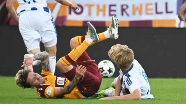 Motherwell's Alex Lowry goes down