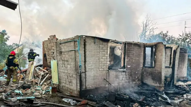 Firefighters work at the site of a private house destroyed during overnight Russian drone strikes, amid Russia's attack on Ukraine, in the town of Balakliia, in Kharkiv region, Ukraine