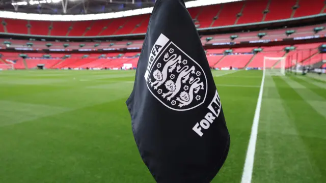 A corner flag showing the English FA badge at Wembley Stadium
