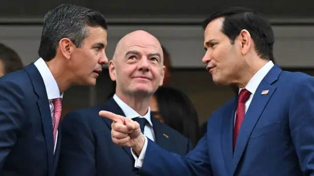 Paraguayan President Santiago Pena, FIFA president Gianni Infantino, and US Secretary of State Marco Rubio talk ahead of the 2026 World Cup Group D football match between USA and Paraguay at the Los Angeles Stadium in Inglewood