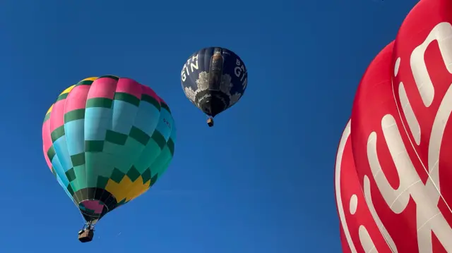 Three balloons in the sky