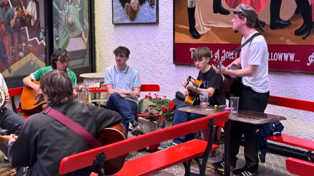 A group of musicians playing in Belfast