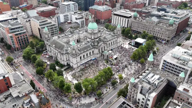 Drone shot showing large crowds outside Belfast City Hall