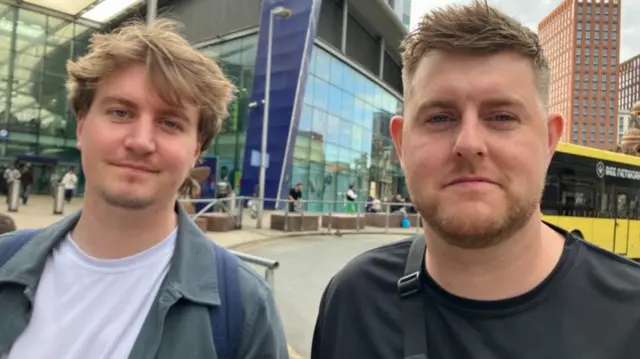 Callum Kirk (right) and his cousin Ben Esson outside train station