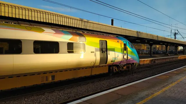 Transpennine Express train at Newcastle central station, with platform and track