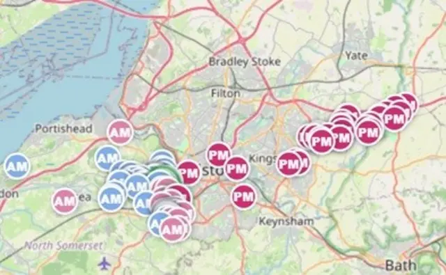 A screenshot of a website of Bristol showing the location of hot air balloons in flight on a balloon tracker, with the balloons showing up as colourful circles