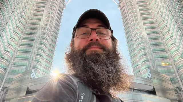 Ryan Milligan poses for a selfie